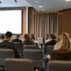 Attendees in conference session