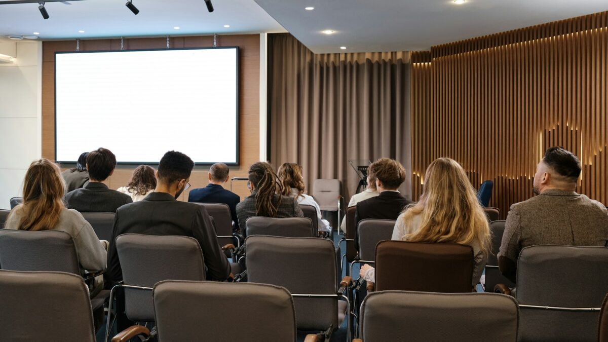 Attendees in conference session